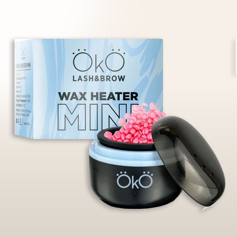 Calentador mini de cera OKO LASH&BROW negro con tapa abierta y cera en perlas.