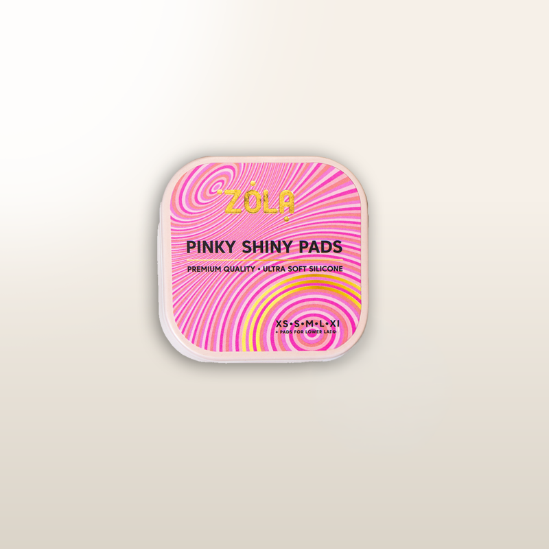 Almohadillas ZOLA® Pinky Shiny en envase rosa con diseño de remolinos arcoíris